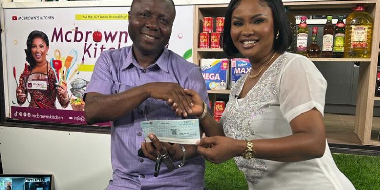 ExecutIVE Director, Crime Check Foundation receiving a cheque for Ghc 10,000 from Nana Ama McBrown